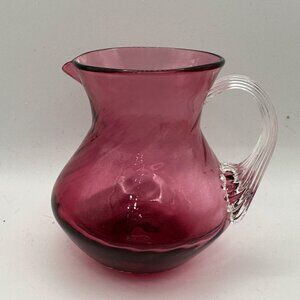 Unbranded hand blown cranberry w/ clear applied handle 3.75” mini glass pitcher